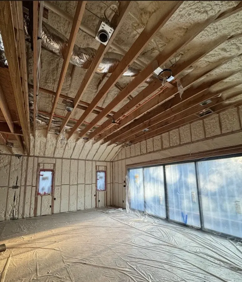 Interior walls and ceiling insulated with spray foam during new construction in Overland